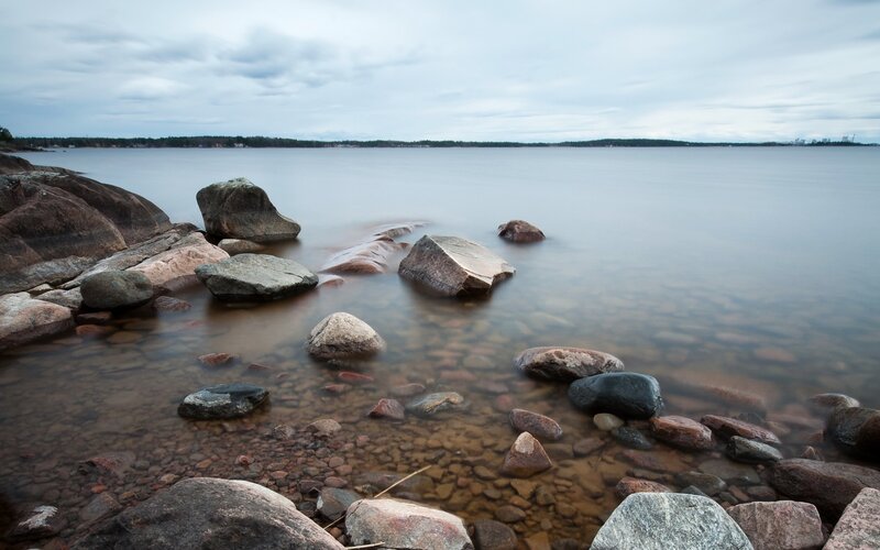 Rocky shoreline at calm sea