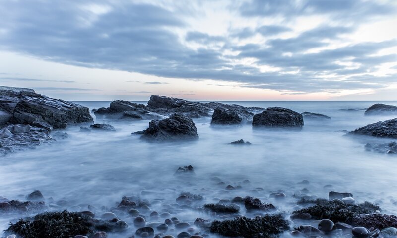 Rocky Shoreline at Dusk — Blue, Serene, Photograph, Rocks, Ocean