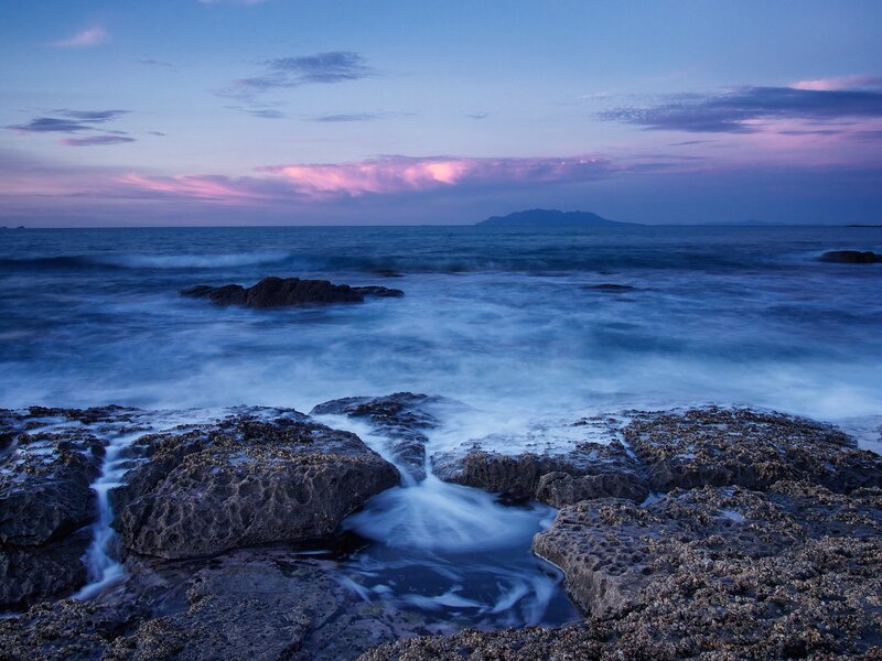 Rocky Shoreline at Dusk — Blue, Serene, Sunset, Photograph, Ocean