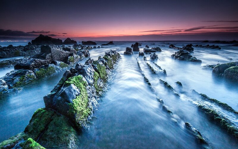 Rocky Shoreline at Dusk — Blue, Serene, Sunset, Photograph, Rocks, Ocean, Sky