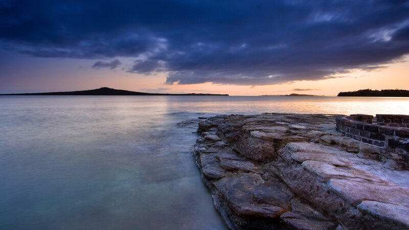 Rocky Shoreline at Dusk — Blue, Serene, Sunset
