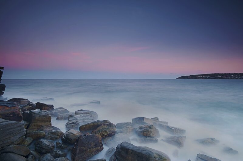 Rocky Shoreline at Dusk — Purple, Serene, Sunset, Photograph, Ocean