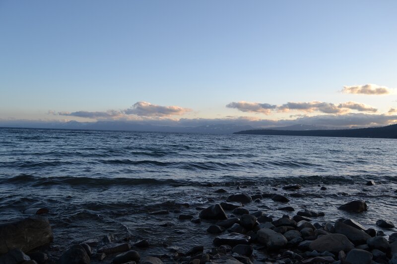 Rocky Shoreline at Lake — Blue, Serene, Sunset