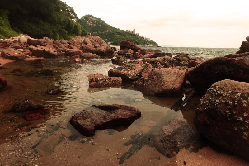 Rocky Shoreline at Low Tide — Brown, Calm