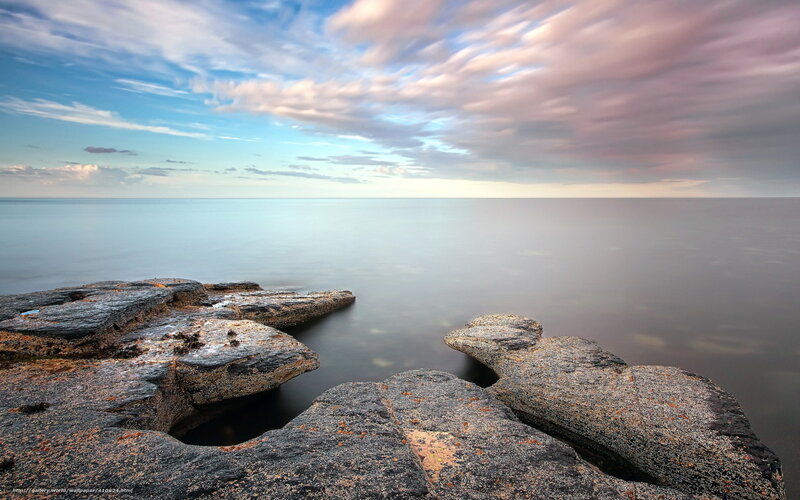Rocky Shoreline at Sea — Blue, Serene, Sunset, Photograph, Rocks