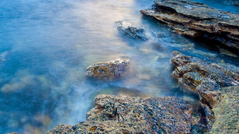 Rocky Shoreline at Sea — Blue