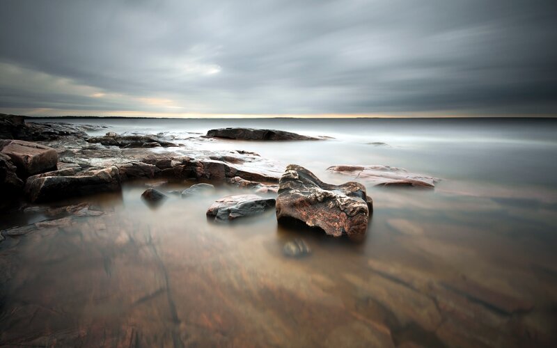 Rocky Shoreline at Sea — Gray, Calm, Sunset