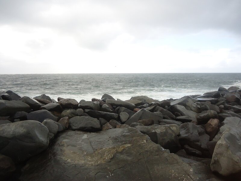Rocky Shoreline at Sea — Gray, Overcast