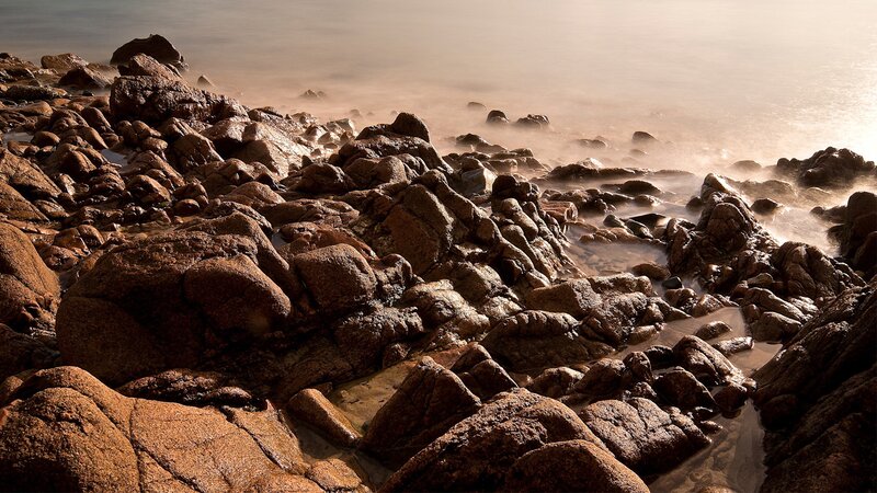 rocky shoreline at sunrise