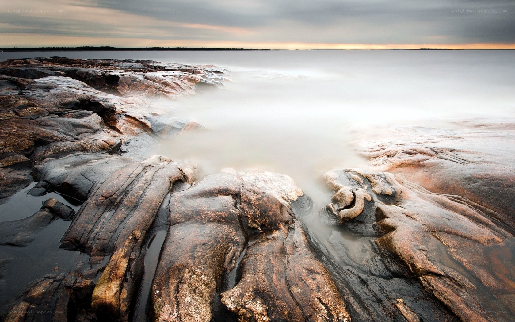 Rocky shoreline at sunset