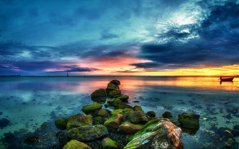 Rocky Shoreline at Sunset — Blue, Dramatic, Photograph, Boat