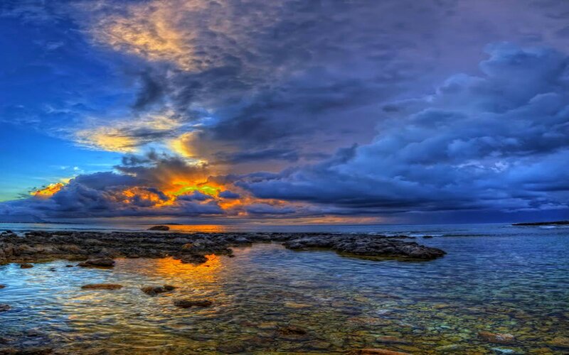 Rocky Shoreline at Sunset — Blue, Dramatic, Photograph, Ocean, Clouds