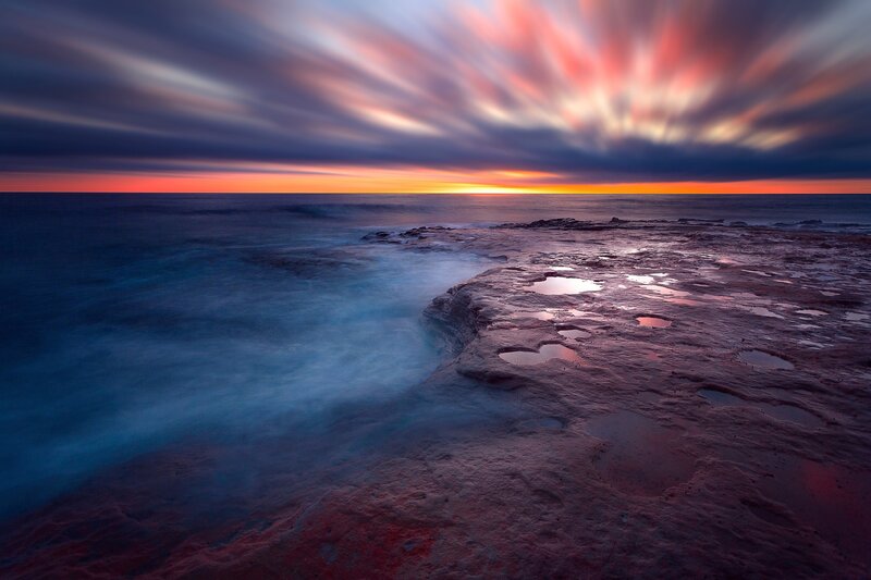 Rocky Shoreline at Sunset — Blue, Dramatic, Photograph, Ocean, Sky