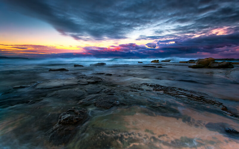 Rocky Shoreline at Sunset — Blue, Dramatic, Photograph, Rocks, Ocean, Clouds