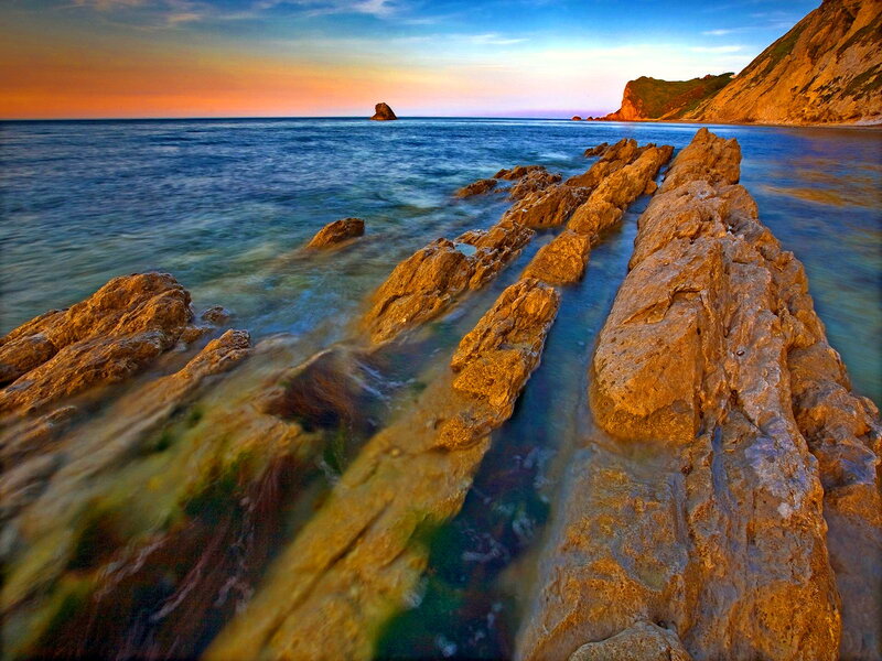 Rocky Shoreline at Sunset — Blue, Serene, Photograph, Ocean, Cliff