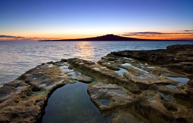 Rocky Shoreline at Sunset — Blue, Serene, Photograph, Ocean, Mountain