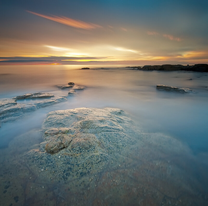Rocky Shoreline at Sunset — Blue, Serene, Photograph, Rocks, Ocean, Sky