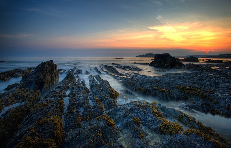 Rocky Shoreline at Sunset — Blue, Serene, Photograph, Rocks, Ocean