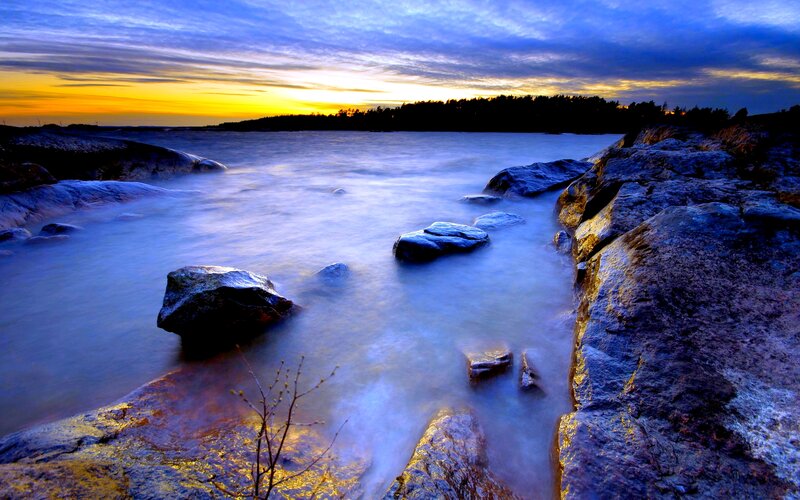 Rocky Shoreline at Sunset — Blue, Serene, Photograph, Rocks, Water