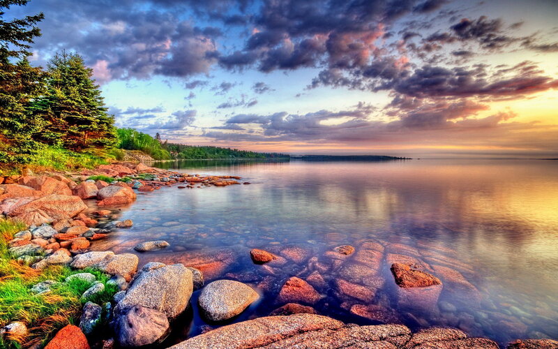 Rocky Shoreline at Sunset — Blue, Serene, Photograph, Trees, Rocks, Sky