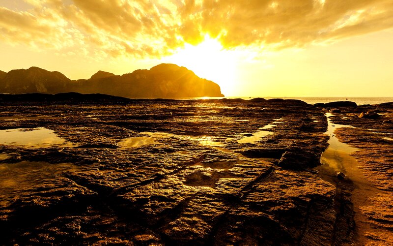 Rocky Shoreline at Sunset — Gold, Dramatic, Photograph, Mountains