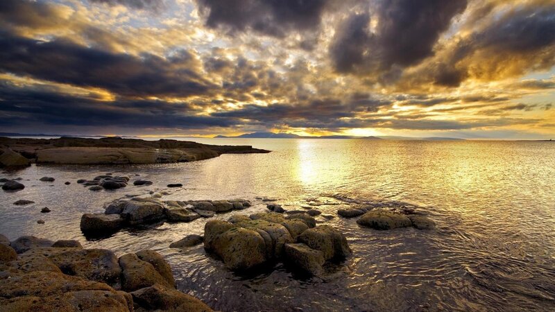Rocky Shoreline at Sunset — Gold, Dramatic, Photograph