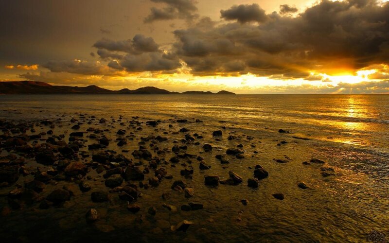 Rocky Shoreline at Sunset — Gold
