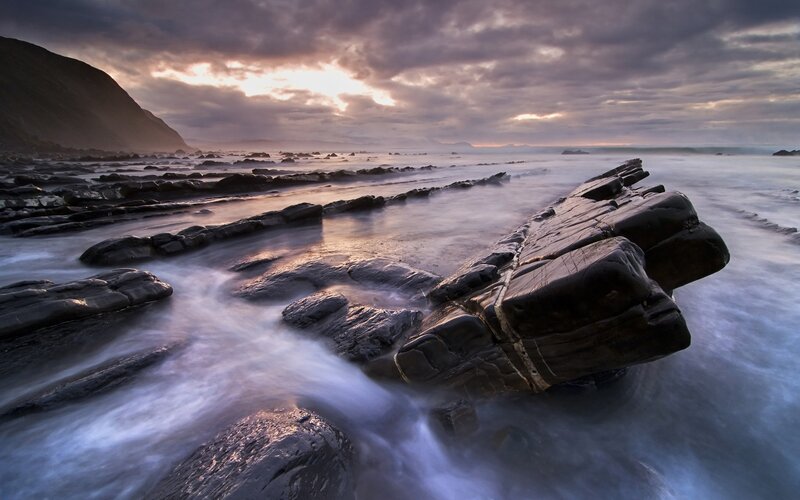 Rocky Shoreline at Sunset — Gray, Dramatic, Photograph, Rocks, Ocean