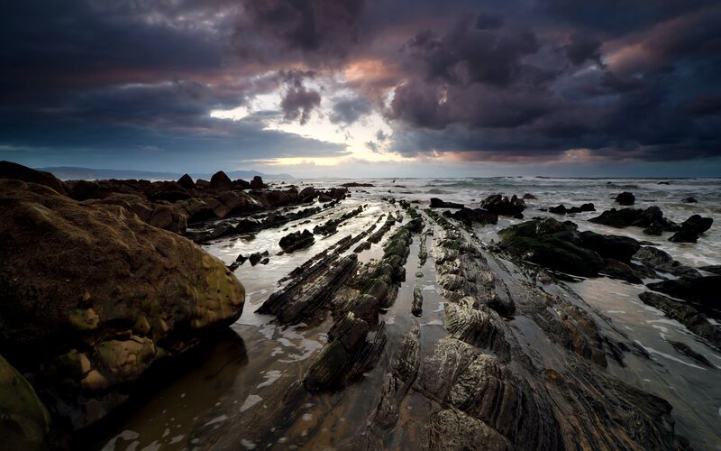 Rocky Shoreline at Sunset — Gray, Dramatic, Photograph, Rocks
