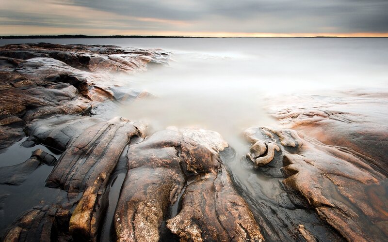 Rocky Shoreline at Sunset — Gray, Serene