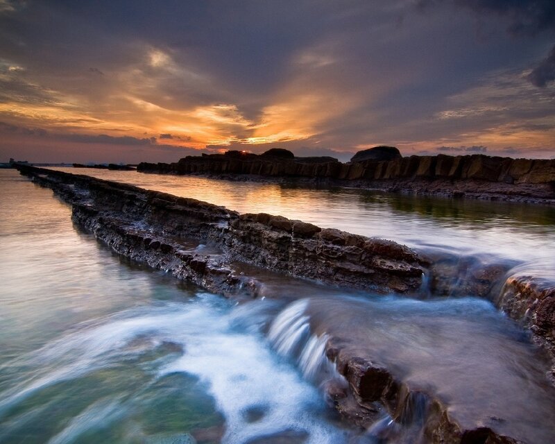 Rocky Shoreline at Sunset — Orange, Dramatic, Photograph, Rocks, Ocean, Sky, Sun