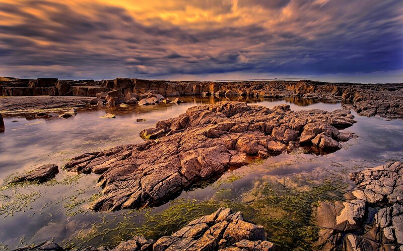 Rocky Shoreline at Sunset — Orange, Dramatic, Photograph, Rocks, Water, Clouds