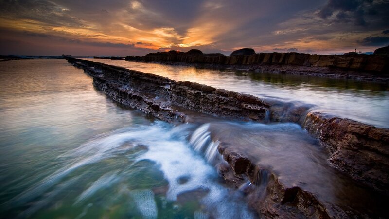 Rocky Shoreline at Sunset — Orange, Dramatic, Photograph, Rocks, Water, Sky