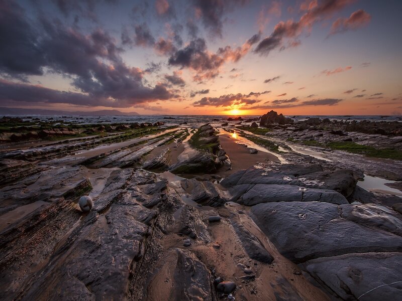 Rocky Shoreline at Sunset — Orange, Dramatic, Photograph, Sun, Clouds, Ocean