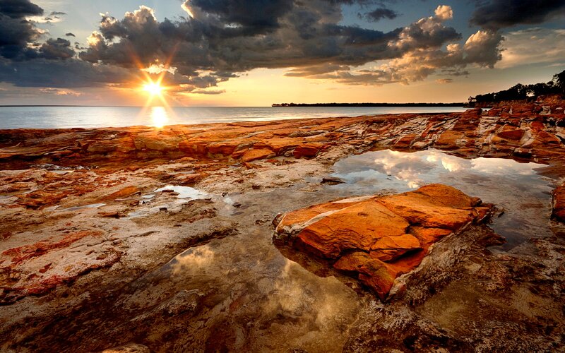 Rocky Shoreline at Sunset — Orange, Dramatic, Photograph, Sun, Clouds