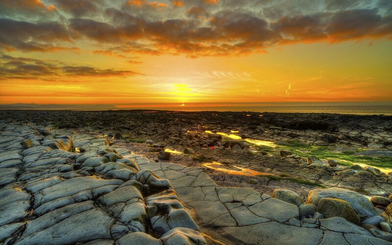 Rocky Shoreline at Sunset — Orange, Dramatic, Photograph, Sun, Ocean, Clouds, Rocks, Yellow