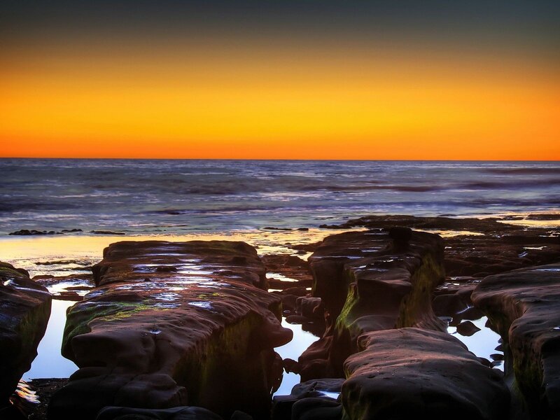 Rocky Shoreline at Sunset — Orange, Serene, Photograph, Ocean, Sky, Rocks, Blue, Black
