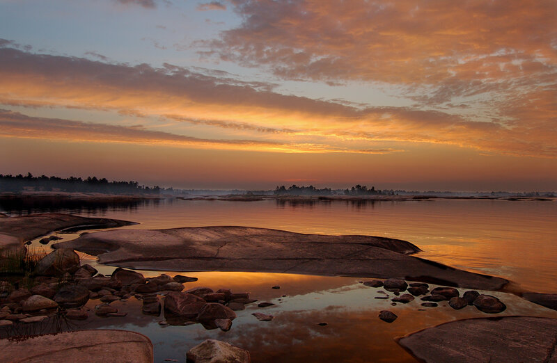 Rocky Shoreline at Sunset — Orange, Serene, Photograph, Rocks, Water