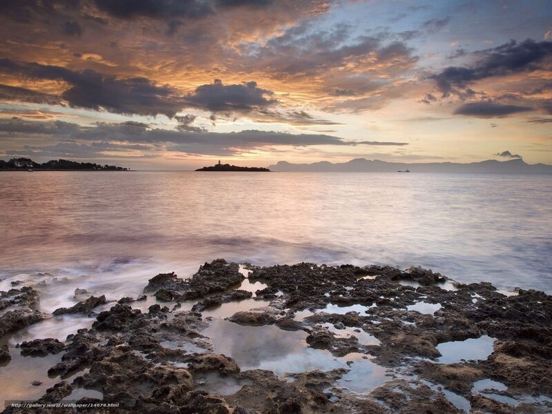Rocky Shoreline at Sunset — Orange, Serene, Photograph, Sea, Clouds