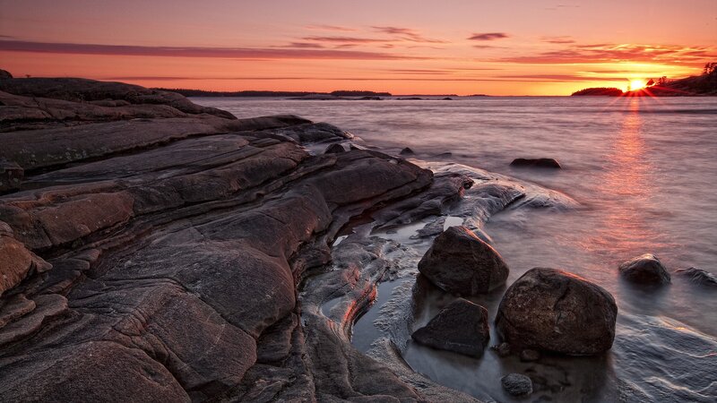 Rocky Shoreline at Sunset — Orange, Serene, Photograph, Sun, Sea