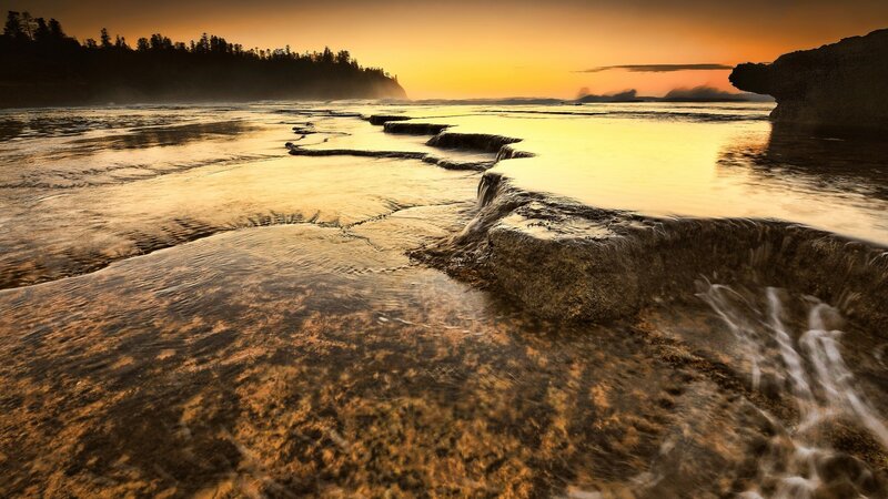 Rocky Shoreline at Sunset — Orange, Serene, Photograph, Water