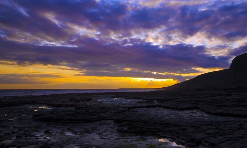 Rocky Shoreline at Sunset — Purple, Dramatic, Photograph