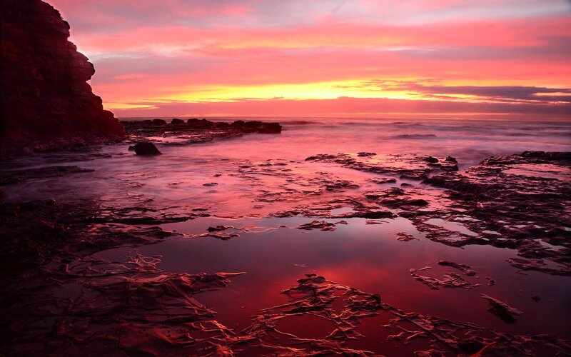 Rocky Shoreline at Sunset — Red, Dramatic, Photograph, Cliff