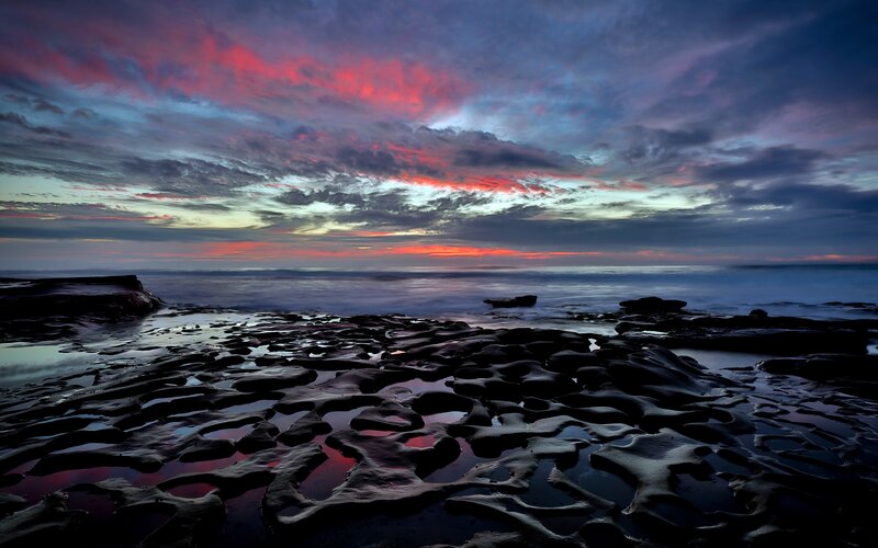 Rocky Shoreline at Sunset — Red, Dramatic, Photograph, Sky, Ocean, Rocks