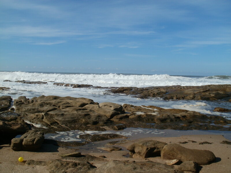 Rocky Shoreline — Blue, Calm, Afternoon