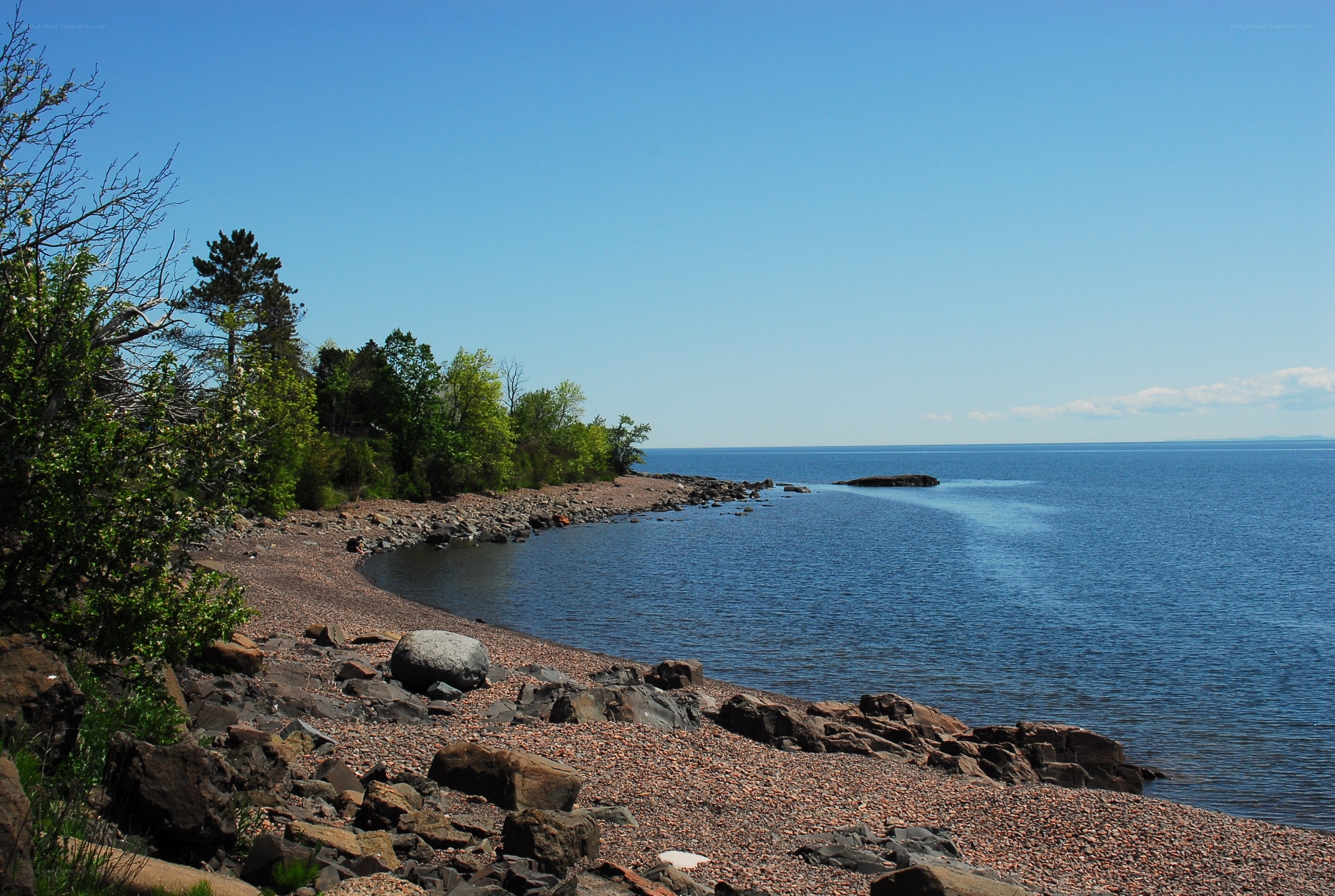 Rocky shoreline by a calm lake