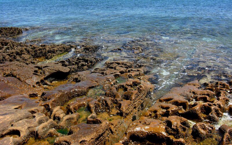 rocky shoreline with clear water