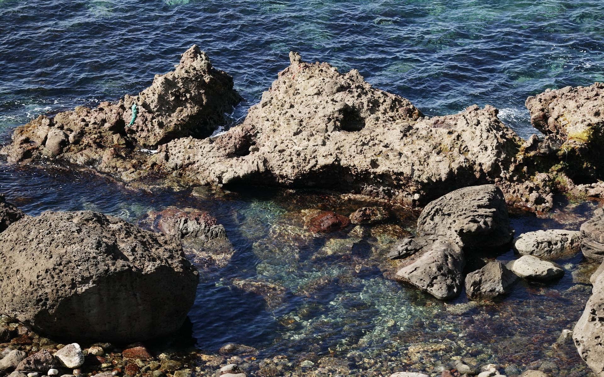rocky shoreline with clear water