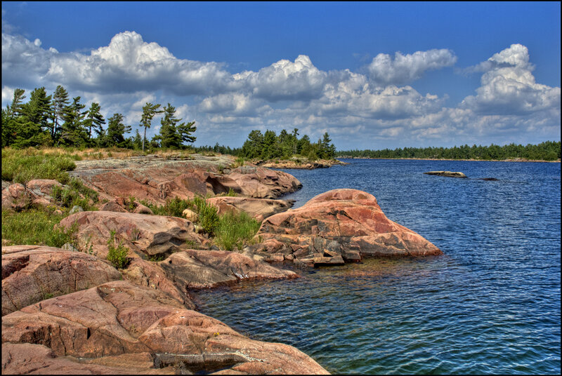Rocky Shoreline with Lake — Blue