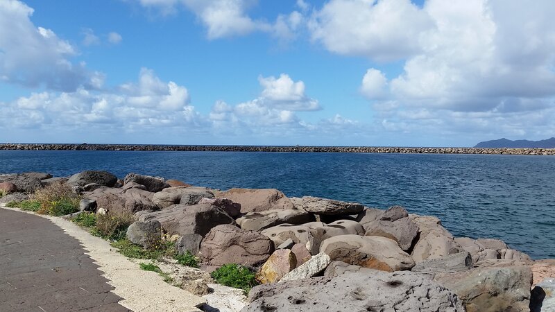 Rocky Shoreline with Pier — Blue, Calm